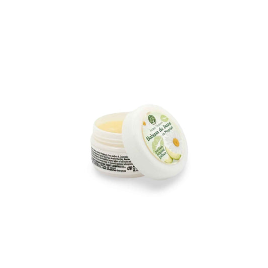 Spatele borcanului cosmetic cu balsam de buze cu mușețel și pepene galben, Herbal Therapy, cu detalii despre ingrediente.